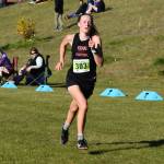 Kenais Jayna Boonstra runs down the last stretch to the finish chute during the Region 3/Division II girls race on Saturday, Oct. 1, 2022 at Tsalteshi Trails just outside of Soldotna, Alaska. (Jake Dye/Peninsula Clarion)