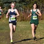 Soldotnas Sophia Jedlicki and Colonys Ella Hopkins race side by side during the Region 3/Division I girls race on Saturday, Oct. 1, 2022 at Tsalteshi Trails just outside of Soldotna, Alaska. (Jake Dye/Peninsula Clarion)