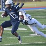 Soldotnas Lokeni Wong breaks a tackle by Eagle Rivers Matthew Watson on Saturday, Oct. 1, 2022, at Justin Maile Field at Soldotna High School in Soldotna, Alaska. (Photo by Jeff Helminiak/Peninsula Clarion)
