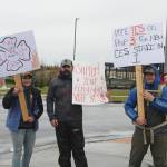 From left, Becca Satathite, Joshua Thompson, Spencer McLean and Emma McLean waive signs in support of Proposition 3 at the intersection of the Kenai Spur and Sterling Highways on Tuesday, Oct. 4, 2022, in Soldotna, Alaska. (Ashlyn OHara/Peninsula Clarion)