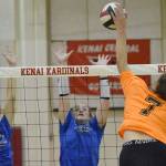 Soldotna's Hallie Fischer and Sadie Lane set up a block on Kenai Central's Emma Beck on Tuesday, Sept. 4, 2022, at Kenai Central High School in Kenai, Alaska. (Photo by Jeff Helminiak/Peninsula Clarion)