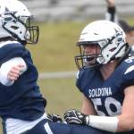 Zac Buckbee and Joe Whittom celebrate after Buckbee's touchdown run in the first quarter Friday, Oct. 7, 2022, at Justin Maile Field at Soldotna High School in Soldotna, Alaska. (Photo by Jeff Helminiak/Peninsula Clarion)