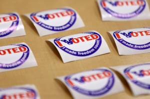 An array of I Voted stickers lie on a table at the Mendenhall Valley Public Library on Tuesday, Oct. 4, 2022, in Juneau, Alaska. (Ben Hohenstatt / Juneau Empire)