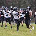 Nikiskis Dwyght Mullins fends off Homers Chris Martishev during the playoff game on Saturday, Oct. 8, 2022, at Nikiski Middle/High School in Nikiski, Alaska. (Jake Dye/Peninsula Clarion)