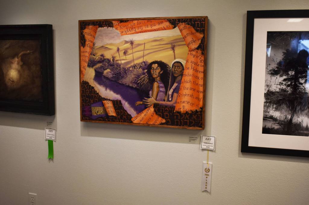 Civil Disobedience, by Charlotte Coots, hangs with its third place ribbon during the opening reception of the Kenai Art Center Biennial Juried Show on Thursday, Oct. 6, 2022, at the Kenai Art Center in Kenai, Alaska. (Jake Dye/Peninsula Clarion)