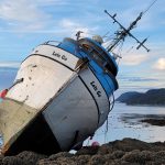A 60-foot fishing vessel was grounded in Favorite Reef on Thursday evening into Friday morning when three passengers were safely rescued off the boat by JPD Chief Ed Mercer. The Coast Guard continues to monitor the ship while crews work to safely defuel it. (Courtesy Photo / Gregory Chaney)