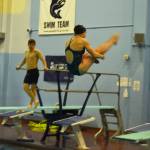 Abriella Werner performs a reverse dive during a practice on Tuesday, Oct. 11, 2022 at Soldotna High School in Soldotna, Alaska. (Jake Dye/Peninsula Clarion)