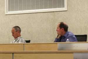 Ashlyn OHara/Peninsula Clarion
Kenai Peninsula Borough Mayor Mike Navarre, right, and his chief of staff, Max Best, participate in an assembly meeting on Tuesday in Soldotna. The meeting was Navarres first as mayor since being appointed last month.