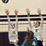 Sewards Teyla Ramsey and Mikinley Williams try to block Nikiskis Savanna Stock on Thursday, Oct. 13, 2022, at Nikiski High School in Nikiski, Alaska. (Photo by Jeff Helminiak/Peninsula Clarion)