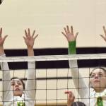 Seward's Teyla Ramsey and Mikinley Williams try to block Nikiski's Savanna Stock on Thursday, Oct. 13, 2022, at Nikiski High School in Nikiski, Alaska. (Photo by Jeff Helminiak/Peninsula Clarion)