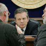 Then-Alaska State Senate President Ben Stevens, R-Anchorage, center, and Sen. Gary Stevens, R-Kodiak right, listen to Sen. Kim Elton, D-Juneau, May 3, 2006, during a Senate floor session at the Capitol in Juneau, Alaska. Ben Stevens, a former Alaska Senate president and a son of the late U.S. Sen. Ted Stevens, died on Thursday, Oct. 13, 2022. He was 63. (AP Photo/Seanna OSullivan, File)