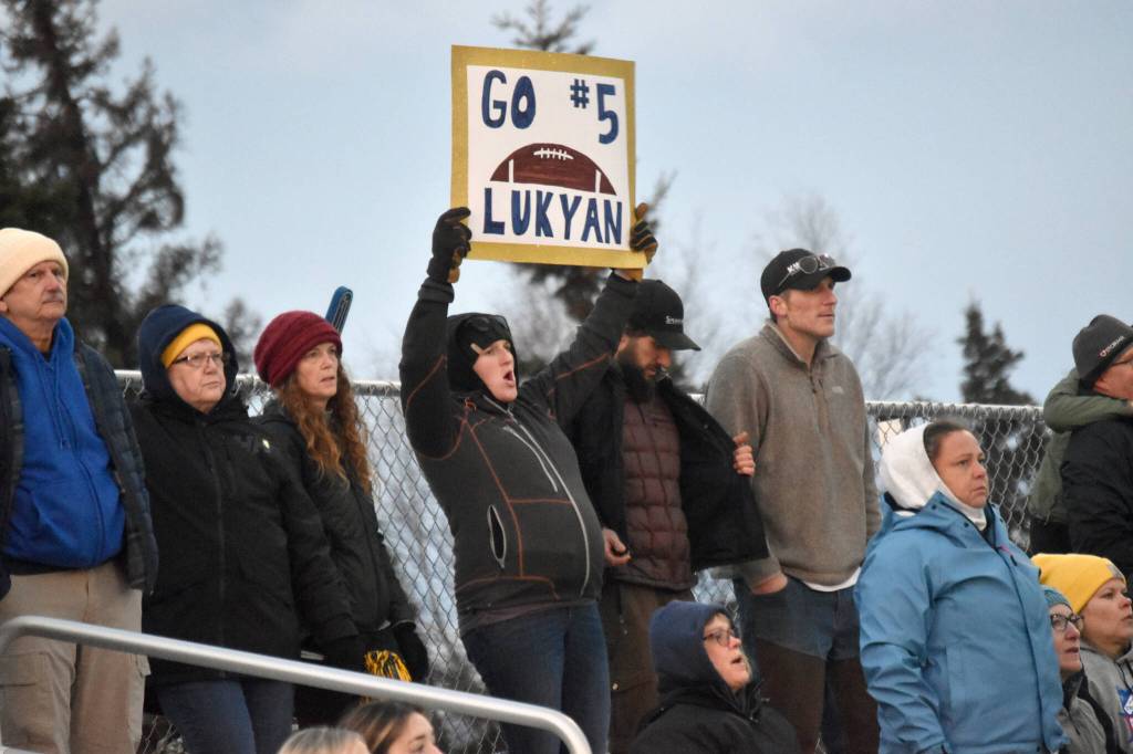 Homer fans cheer on their team Saturday, Oct. 15, 2022, in the Division III state championship game at Service High School in Anchorage, Alaska. (Photo by Jeff Helminiak/Peninsula Clarion)