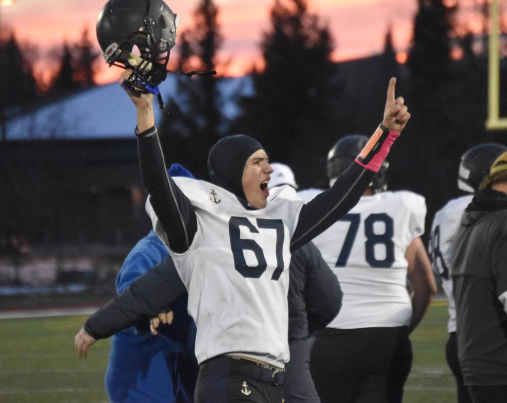 Homers Owen Storm celebrates Saturday, Oct. 15, 2022, at the Division III state championship game at Service High School in Anchorage, Alaska. (Photo by Jeff Helminiak/Peninsula Clarion)