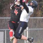 Homers Carter Tennison breaks up a pass intended for Houstons Hayden Howard on Saturday, Oct. 15, 2022, in the Division III state championship game at Service High School in Anchorage, Alaska. (Photo by Jeff Helminiak/Peninsula Clarion)