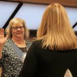 Kenai City Clerk Shellie Saner, right, swears in Victoria Askin during a Kenai City Council meeting on Wednesday, Oct. 19, 2022, in Kenai, Alaska. (Ashlyn OHara/Peninsula Clarion)