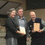 Kenai Mayor Brian Gabriel, center, presents Kenai City Council member Glenese Pettey, left, and Kenai Vice Mayor Jim Glendening with plaques at a council meeting on Wednesday, Oct. 19, 2022, in Kenai, Alaska. (Ashlyn OHara/Peninsula Clarion)