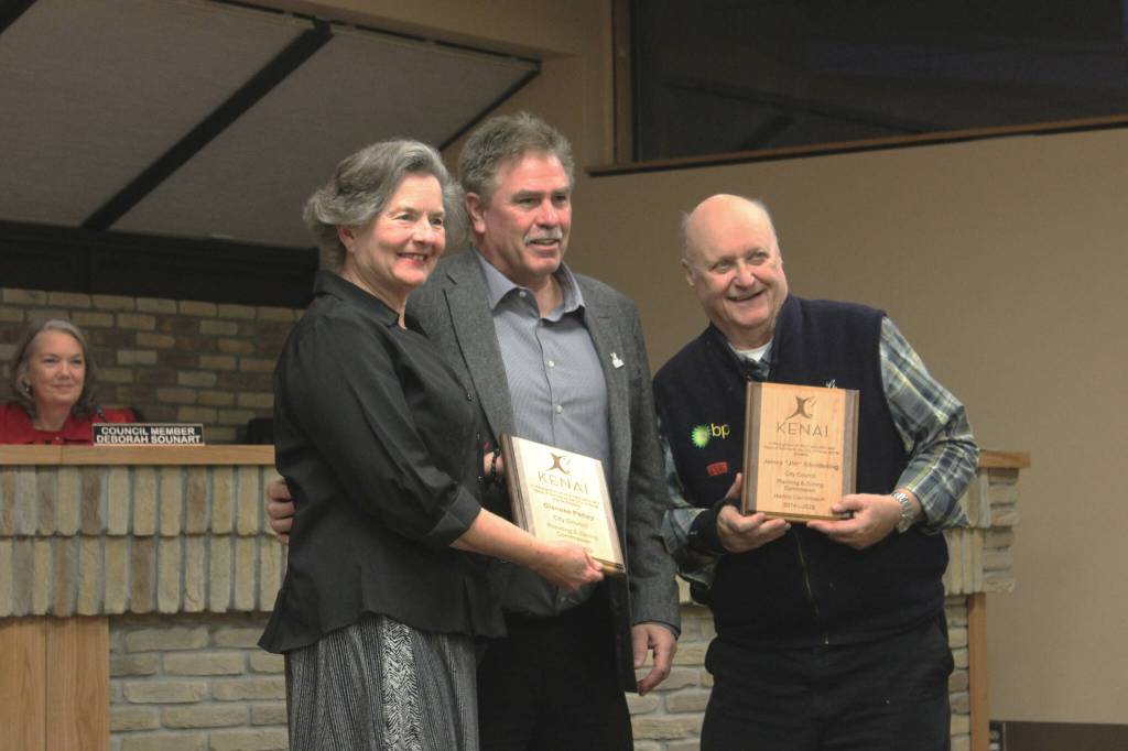 Kenai Mayor Brian Gabriel, center, presents Kenai City Council member Glenese Pettey, left, and Kenai Vice Mayor Jim Glendening with plaques at a council meeting on Wednesday, Oct. 19, 2022, in Kenai, Alaska. (Ashlyn OHara/Peninsula Clarion)