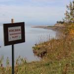 A sign warning residents of of bluff erosion is seen here at the end of Spur View Drive in Kenai, Alaska, on Sept. 14, 2020. (Photo by Brian Mazurek/Peninsula Clarion file)