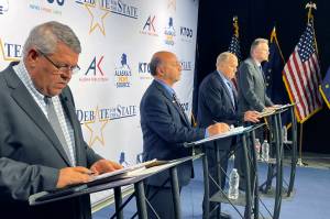 AP Photo / Mark Thiessen 
The four candidates for Alaska governor are shown preparing for a televised debate Wednesday, in Anchorage, ahead of the 2022 general election. From left are Republican Charlie Pierce; Democrat Les Gara; former Gov. Bill Walker, an independent; and Gov. Mike Dunleavy, a Republican.