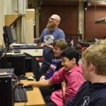 From left, Coach Jonus Kaponus Angleton, Bryce LeFevre, Dalton Schanrock and Graehm LeFevre celebrate victory during SoHi's Rocket League match against Thunder Mountain High School on Thursday, Oct. 20, 2022 at Skyview Middle School in Soldotna, Alaska. (Jake Dye/Peninsula Clarion)