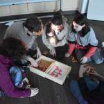 Teens distribute the zombie cure  Zombie Skittles  after completing the escape room on Oct. 21, 2022, at Soldotna Public Library in Soldotna, Alaska. (Jake Dye/Peninsula Clarion)