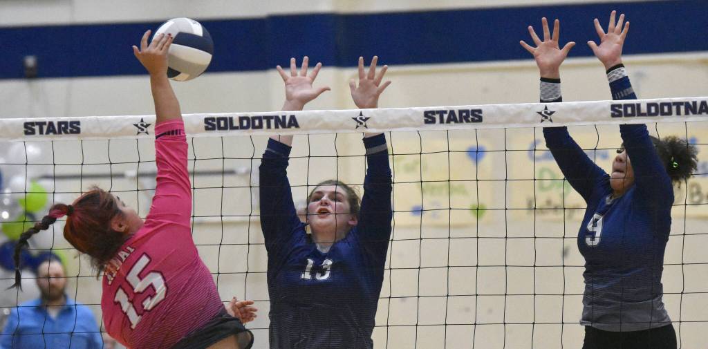 Kenai Centrals Genesis Trevino attacks on Soldotnas Karley Johnson and Athena Rossiter on Tuesday, Oct. 25, 2022, at Soldotna High School in Soldotna, Alaska. (Photo by Jeff Helminiak/Peninsula Clarion)