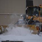 Snow is cleared from the parking lot at Kenai Cinema in Kenai, Alaska on Wednesday, Oct. 26, 2022. (Jake Dye/Peninsula Clarion)