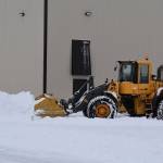 Snow is cleared from the parking lot at Kenai Cinema in Kenai, Alaska on Wednesday, Oct. 26, 2022. (Jake Dye/Peninsula Clarion)