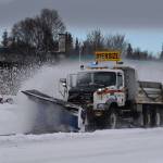 A plow truck clears snow as it moves down the Kenai Spur Highway in Kenai on Wednesday. (Jake Dye/Peninsula Clarion)