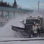 A plow truck clears snow as it moves down the Kenai Spur Highway in Kenai, Alaska on Wednesday, Oct. 26, 2022. (Jake Dye/Peninsula Clarion)