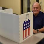 Gary Anderson fills out an early voting ballot on Thursday, Oct. 27, 2022, at Kenai City Hall in Kenai, Alaska. (Jake Dye/Peninsula Clarion)