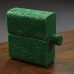 A sample of Patrick Simpsons recycled plastic lumber is photographed in the Peninsula Clarion newsroom on Friday, Oct. 28, 2022, in Kenai, Alaska. (Jake Dye/Peninsula Clarion)