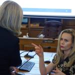 Rep. Andi Story, D-Juneau, talks with then-Department of Administration Commissioner Kelly Tshibaka Tuesday morning following a House Administration Committee Finance Subcommittee meeting in 2020. (Ben Hohenstatt / Juneau Empire File)