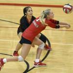 Kenai Centrals Kimberly Chanley digs up a ball in front of Jaycie Castillo on Friday, Oct. 28, 2022, at Kenai Central High School in Kenai, Alaska. (Photo by Jeff Helminiak/Peninsula Clarion)
