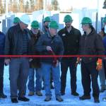 Homer Electric Association Board of Directors Dan Furlong, center, cuts the ribbon at a ceremony celebrating HEAs Tesla battery energy storage system on Tuesday, Nov. 1, 2022, near Soldotna, Alaska. (Ashlyn OHara/Peninsula Clarion)