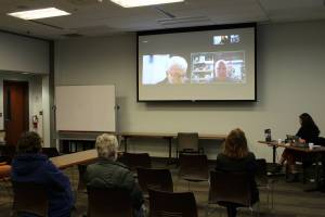 Candidates for Alaska State Senate District C Gary Stevens, on screen, left, and Heath Smith, on screen, right, participate remotely in a forum held at the Soldotna Public Library on Monday, Oct. 24, 2022 in Soldotna, Alaska. (Ashlyn OHara/Peninsula Clarion)