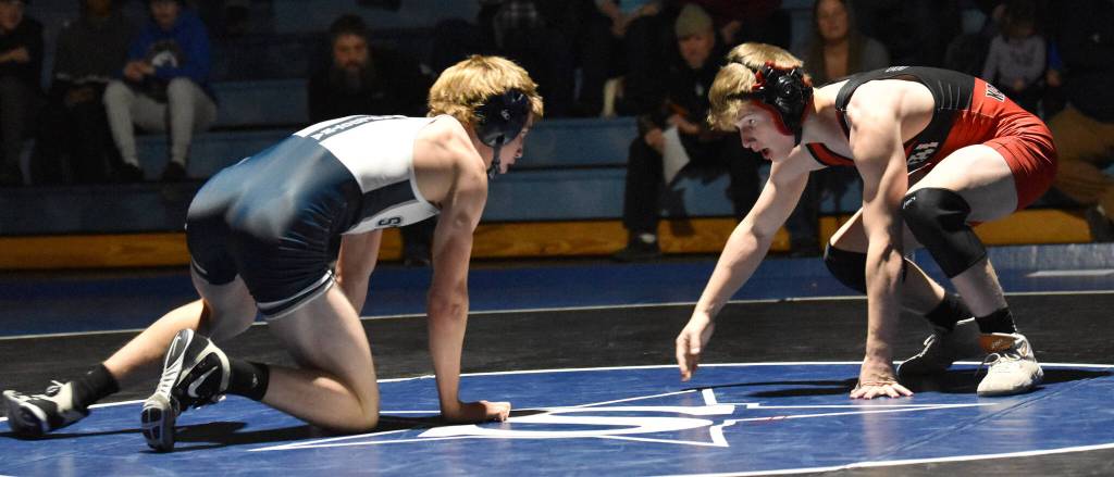 Soldotnas Michael Dickinson and Kenai Centrals Daniel Steffensen face off at 135 pounds Tuesday, Nov. 1, 2022, at Soldotna High School in Soldotna, Alaska. Steffensen defeated Dickinson 6-2. (Photo by Jeff Helminiak/Peninsula Clarion)