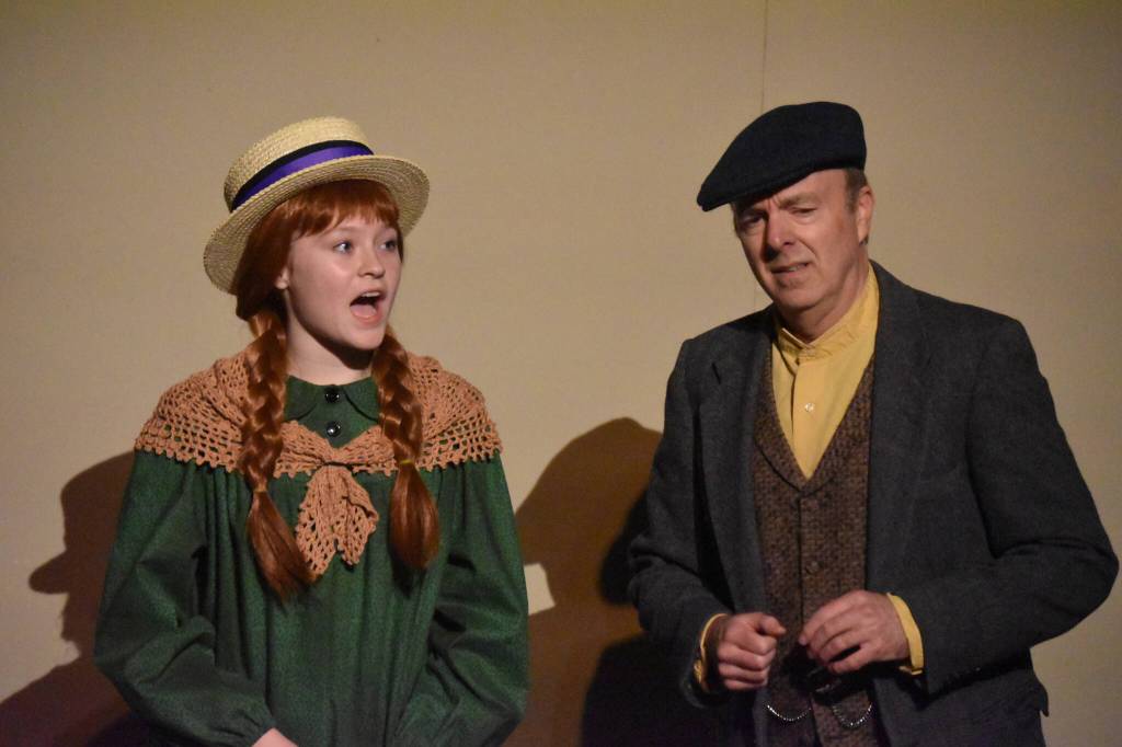 Truly Hondel portrays Anne Shirley and Todd Sherwood portrays Matthew Cuthbert in a rehearsal of Anne of Green Gables at the Kenai Performers Black Box Theatre in Soldotna, Alaska, on Tuesday, Nov. 1, 2022. (Jake Dye/Peninsula Clarion)