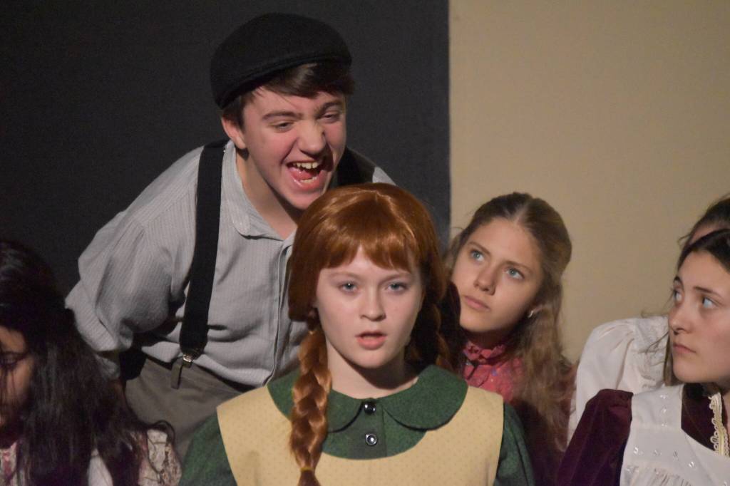 Jackson Hooper, as Gilbert, taunts Truly Hondel, as Anne, in a rehearsal of Anne of Green Gables at the Kenai Performers Black Box Theatre in Soldotna, Alaska, on Tuesday, Nov. 1, 2022. (Jake Dye/Peninsula Clarion)