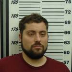 A police mugshot of Kirby Calderwood, 32, of Ogden, Utah, the man charged in the murder and kidnapping of Anesha Duffy Murnane. (Photo provided/Homer Police)