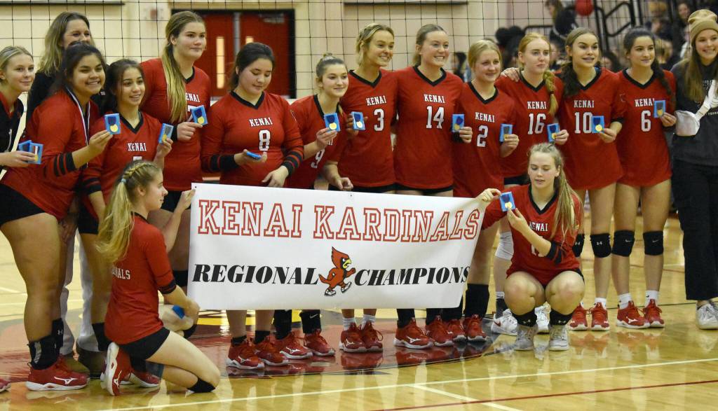 Kenai Central poses with first-place medals Saturday, Nov. 5, 2022, at the Southcentral Conference volleyball tournament at Kenai Central High School in Kenai, Alaska. (Photo by Jeff Helminiak/Peninsula Clarion)