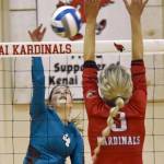 Nikiskis Savanna Stock attacks Kenai Centrals Cali Holmes on Saturday, Nov. 5, 2022, at the Southcentral Conference volleyball tournament at Kenai Central High School in Kenai, Alaska. (Photo by Jeff Helminiak/Peninsula Clarion)