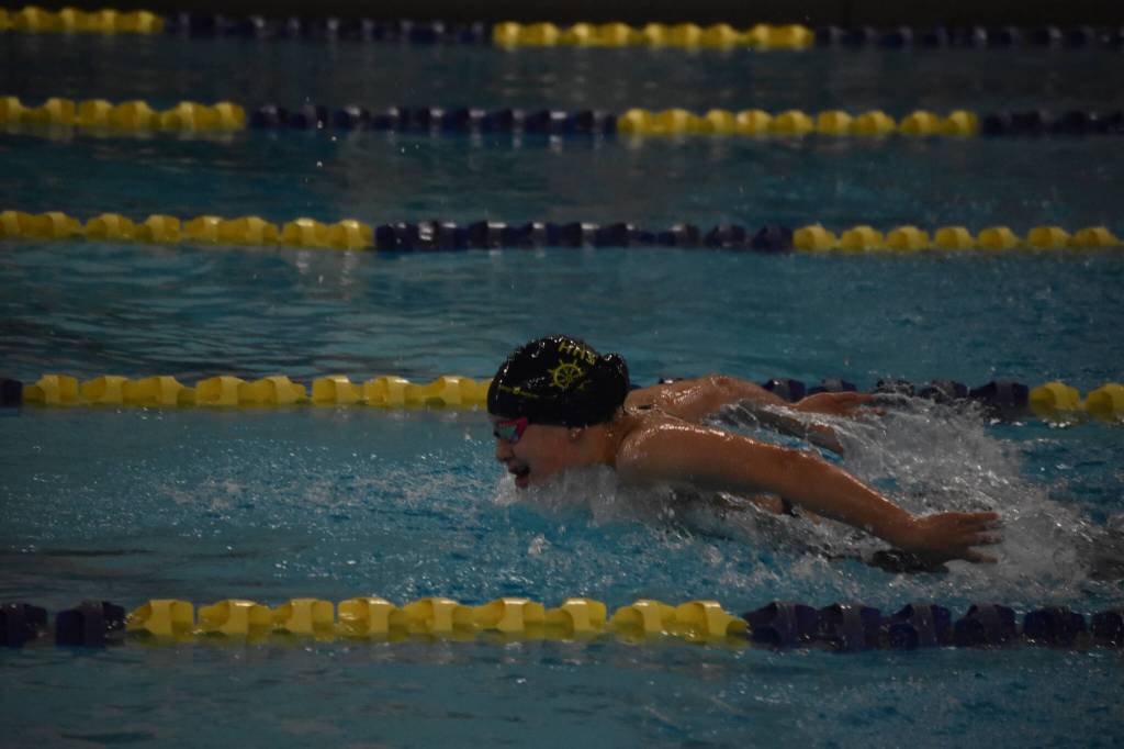 Homer's Carly Nelson swims the 100-yard butterfly during finals at the ASAA State Swim & Dive Championships on Saturday, Nov. 5, 2022, at Bartlett High School in Anchorage, Alaska. (Jake Dye/Peninsula Clarion)