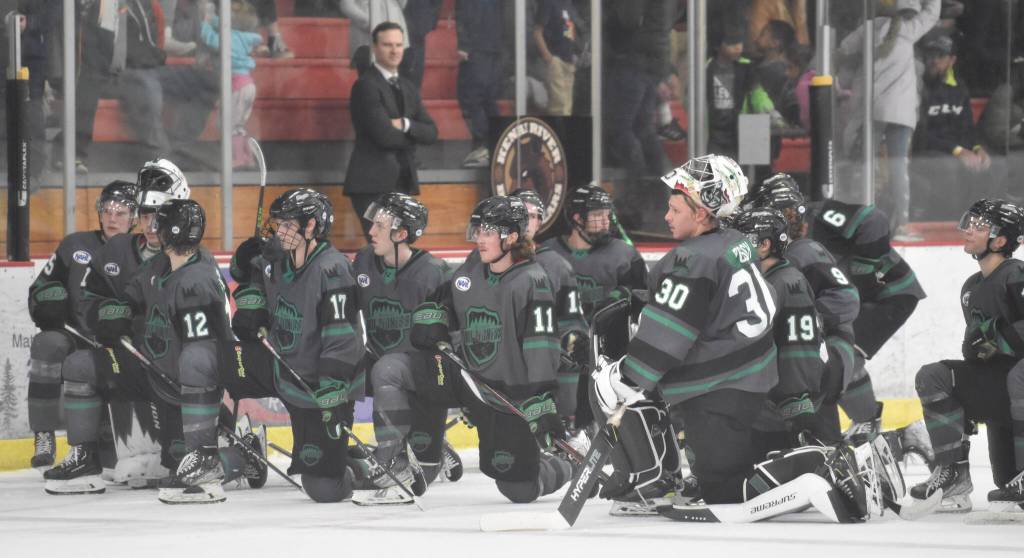 Members of the Minnesota Wilderness watch as teammate Oliver Stumpel is treated Saturday, Nov. 5, 2022, at the Soldotna Regional Sports Complex in Soldotna, Alaska. Stumpel was removed from the ice on a stretcher. (Photo by Jeff Helminiak/Peninsula Clarion)