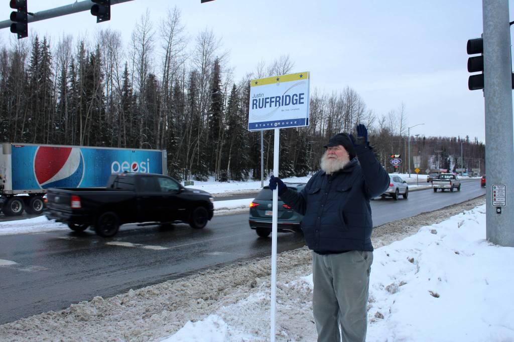 Larry Opperman waves a sign in support of Alaska House candidate Justin Ruffridge at the intersection of the Kenai Spur and Sterling highways on Tuesday, Nov. 8, 2022 in Soldotna, Alaska. (Ashlyn OHara/Peninsula Clarion)