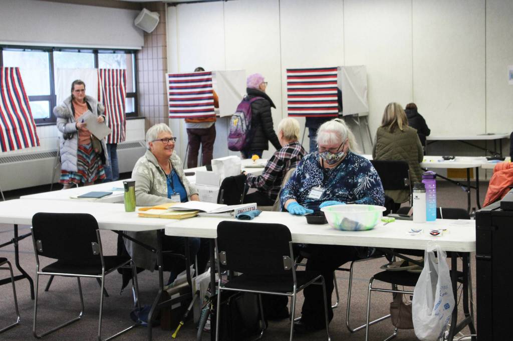 K-Beach Precinct Chair Kathy Carson (right) and Carol Louthan (left) assist voters at the Soldotna Regional Sports Complex on Tuesday, Nov. 8, 2022 in Soldotna, Alaska. (Ashlyn OHara/Peninsula Clarion)