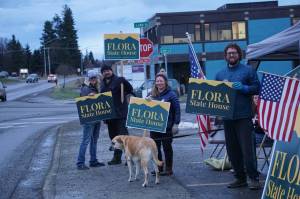 Friends and family of Louie Flora wave signs in support of the candidate for District 6 State House Representative on Tuesday, Nov. 8, 2022, on Pioneer Avenue in Homer, Alaska. From left to right are Chelsea Jones, Jon Flora, Sandy the dog, Sarah Banks and Mikee Flora. Louie Floras children Sidney and Rocco are in the tent to the right. (Photo by Michael Armstrong/Homer News)
Friends and family of Louie Flora wave signs in support of the candidate for District 6 State House Representative on Tuesday, Nov. 8, 2022, on Pioneer Avenue in Homer, Alaska. From left to right are Chelsea Jones, Jon Flora, Sandy the dog, Sarah Banks and Mikee Flora. Louie Floras children Sidney and Rocco are in the tent to the right. (Photo by Michael Armstrong/Homer News)
