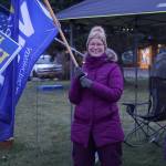 Rep. Sarah Vance, R-Homer, waves a campaign flag on Tuesday, Nov. 8, 2022, at WKFL Park in Homer, Alaska. Vance was part of a group supporting Republican Party candidates including Heath Smith, running for State Senate District C, Kelly Tshibaka, running for U.S. Senate, and Nick Begich III, running for U.S. Congress. (Photo by Michael Armstrong/Homer News)