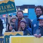 Louie Flora, center, a candidate for District 6 State House Representative, waves a sign on Tuesday, Nov. 8, 2022, on Pioneer Avenue in Homer, Alaska. Behind him is former Rep. Paul Seaton and Tina Seaton, and in front is his wife, Sarah Banks, brother Mikee Flora, and friend Chelsea Jones. (Photo by Michael Armstrong/Homer News)