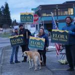 Friends and family of Louie Flora wave signs in support of the candidate for District 6 State House Representative on Tuesday, Nov. 8, 2022, on Pioneer Avenue in Homer, Alaska. From left to right are Chelsea Jones, Jon Flora, Sandy the dog, Sarah Banks and Mikee Flora. Louie Flora's children Sidney and Rocco are in the tent to the right. (Photo by Michael Armstrong/Homer News)